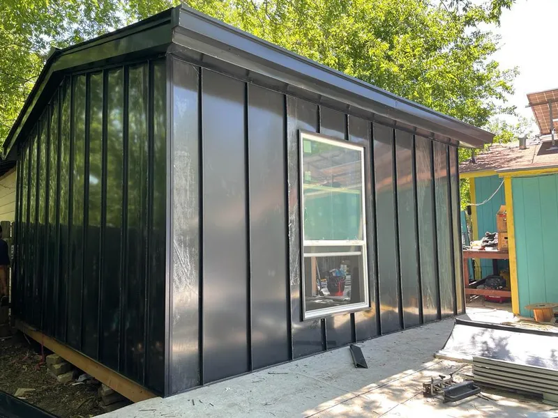 Black standing seam metal wall panels for Roof Inspection in McHenry